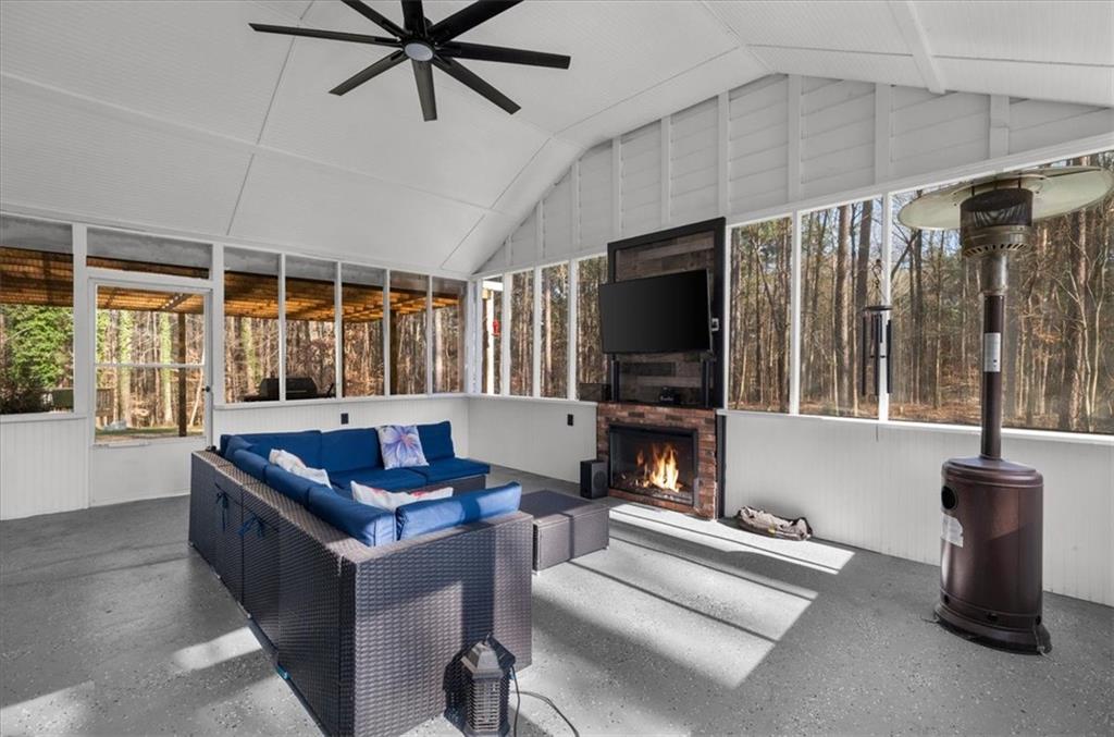 5802 Bay Pointe Sound Acworth, GA 30101 - Photo 30 of 41 a living room with furniture a flat screen tv and a large window