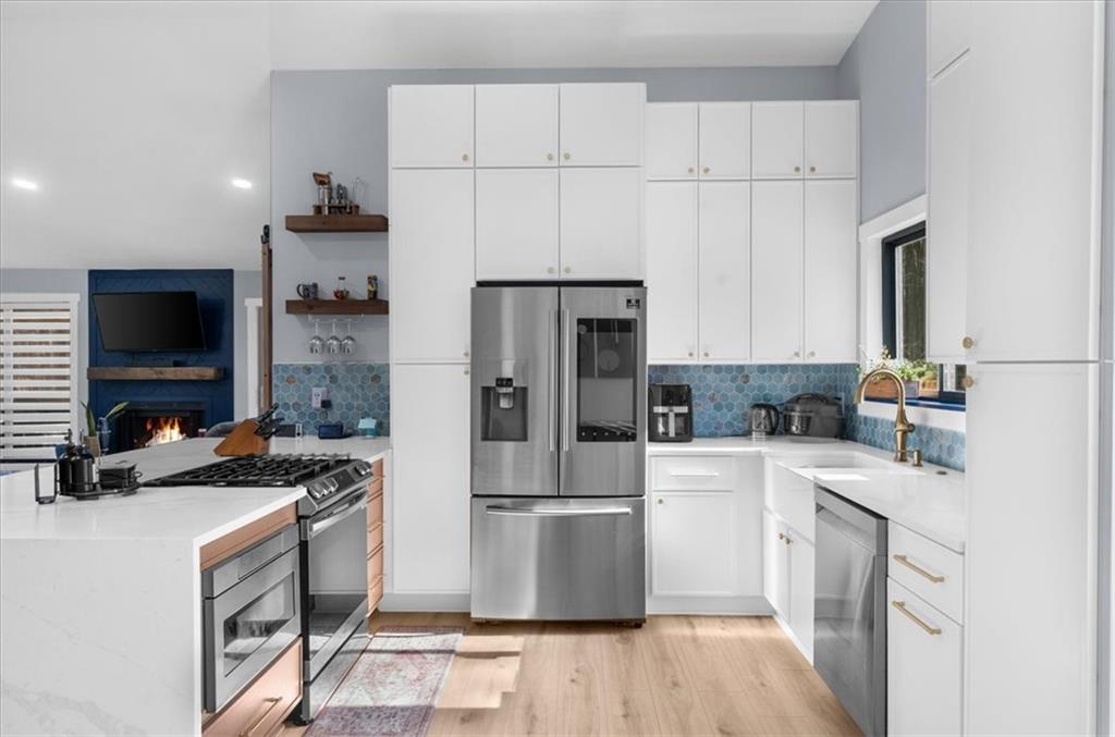 5802 Bay Pointe Sound Acworth, GA 30101 - Photo 3 of 41 a kitchen with a sink a stove and refrigerator
