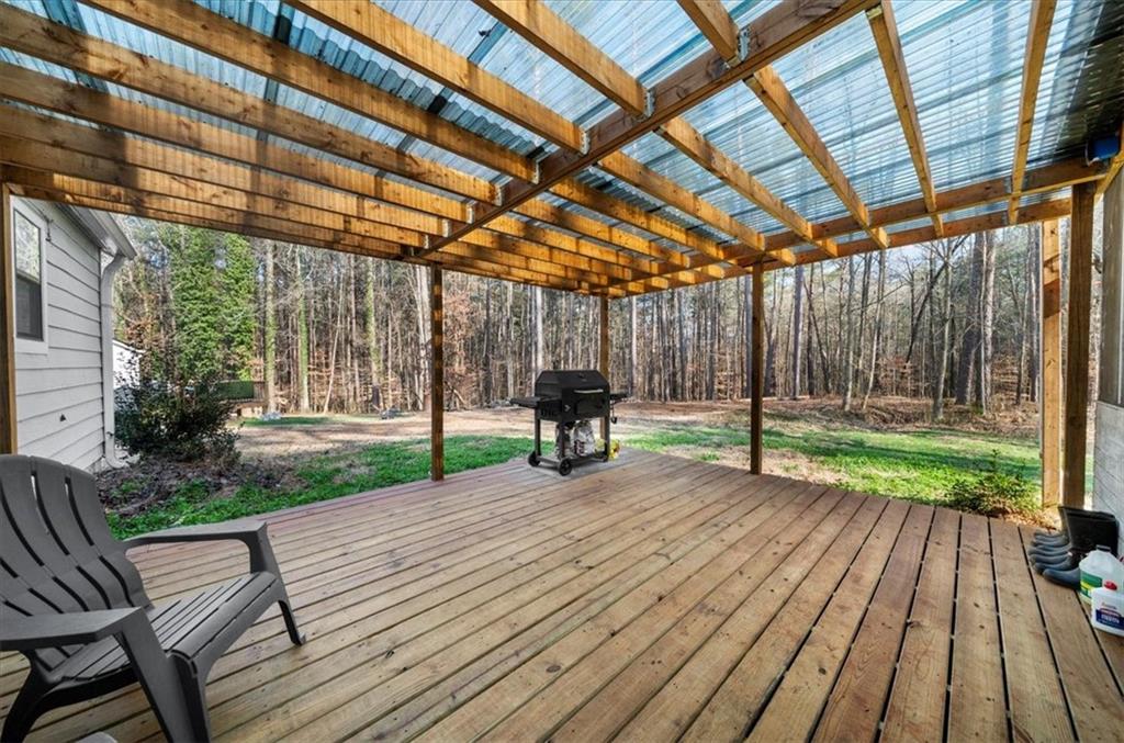 5802 Bay Pointe Sound Acworth, GA 30101 - Photo 31 of 41 a view of a backyard with wooden floor