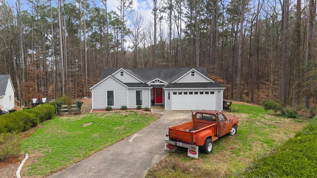 5802 Bay Pointe Sound Acworth, GA 30101 - Photo 33 of 41 a house with trees in front of it