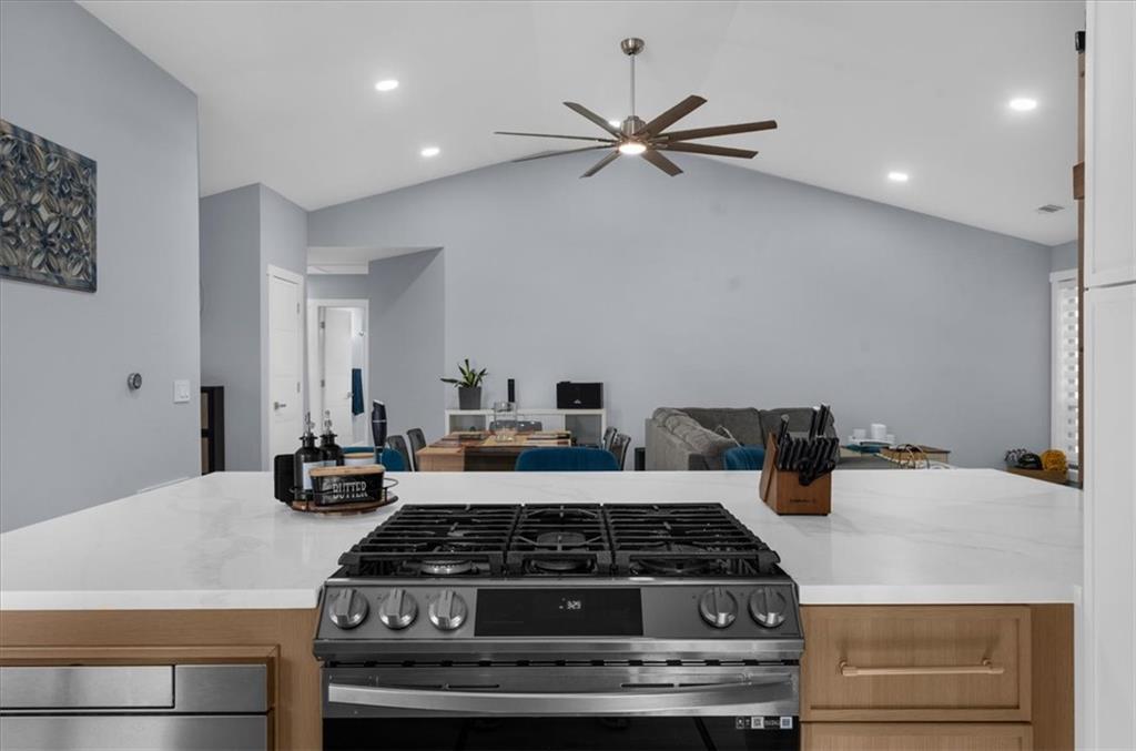 5802 Bay Pointe Sound Acworth, GA 30101 - Photo 5 of 41 a kitchen with a stove and white cabinets