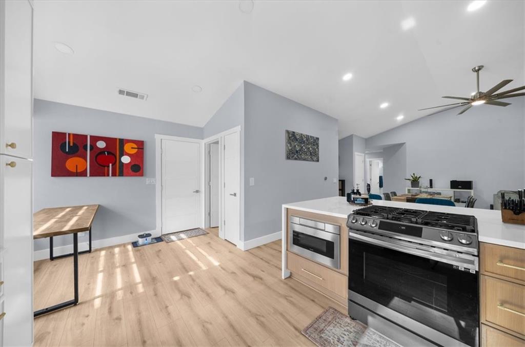 5802 Bay Pointe Sound Acworth, GA 30101 - Photo 6 of 41 a kitchen with a stove and a flat screen tv