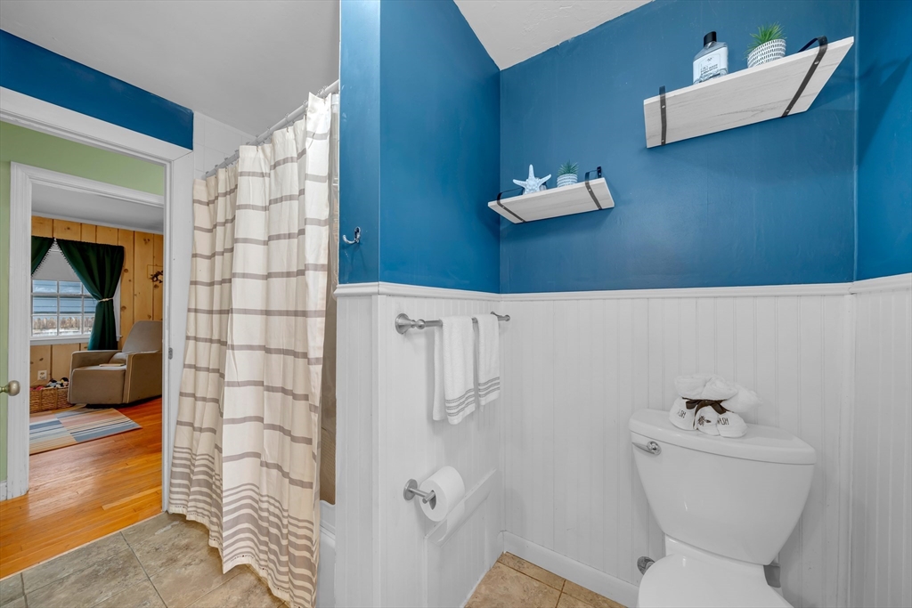 69 Pond Street Georgetown, MA 01833 - Photo 13 of 30 a bathroom with a toilet and a shower