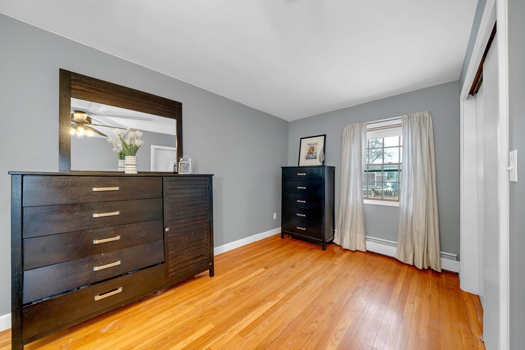 69 Pond Street Georgetown, MA 01833 - Photo 18 of 30 a room with a dresser and a mirror