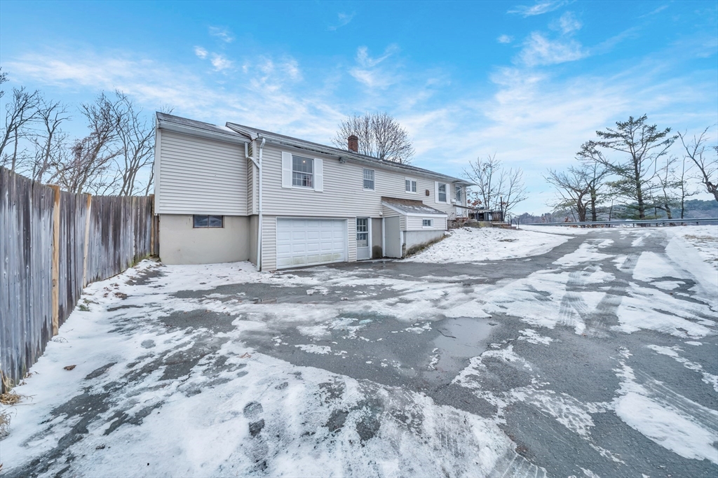 69 Pond Street Georgetown, MA 01833 - Photo 26 of 30 a view of a backyard with a large tree