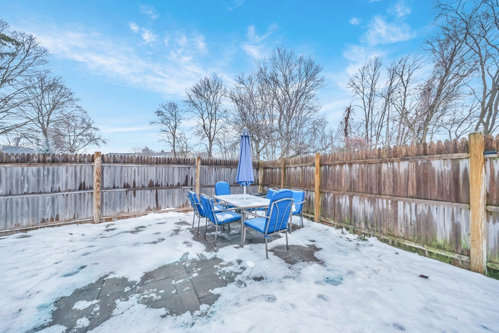 69 Pond Street Georgetown, MA 01833 - Photo 28 of 30 a view of a sitting area with trees in the backyard