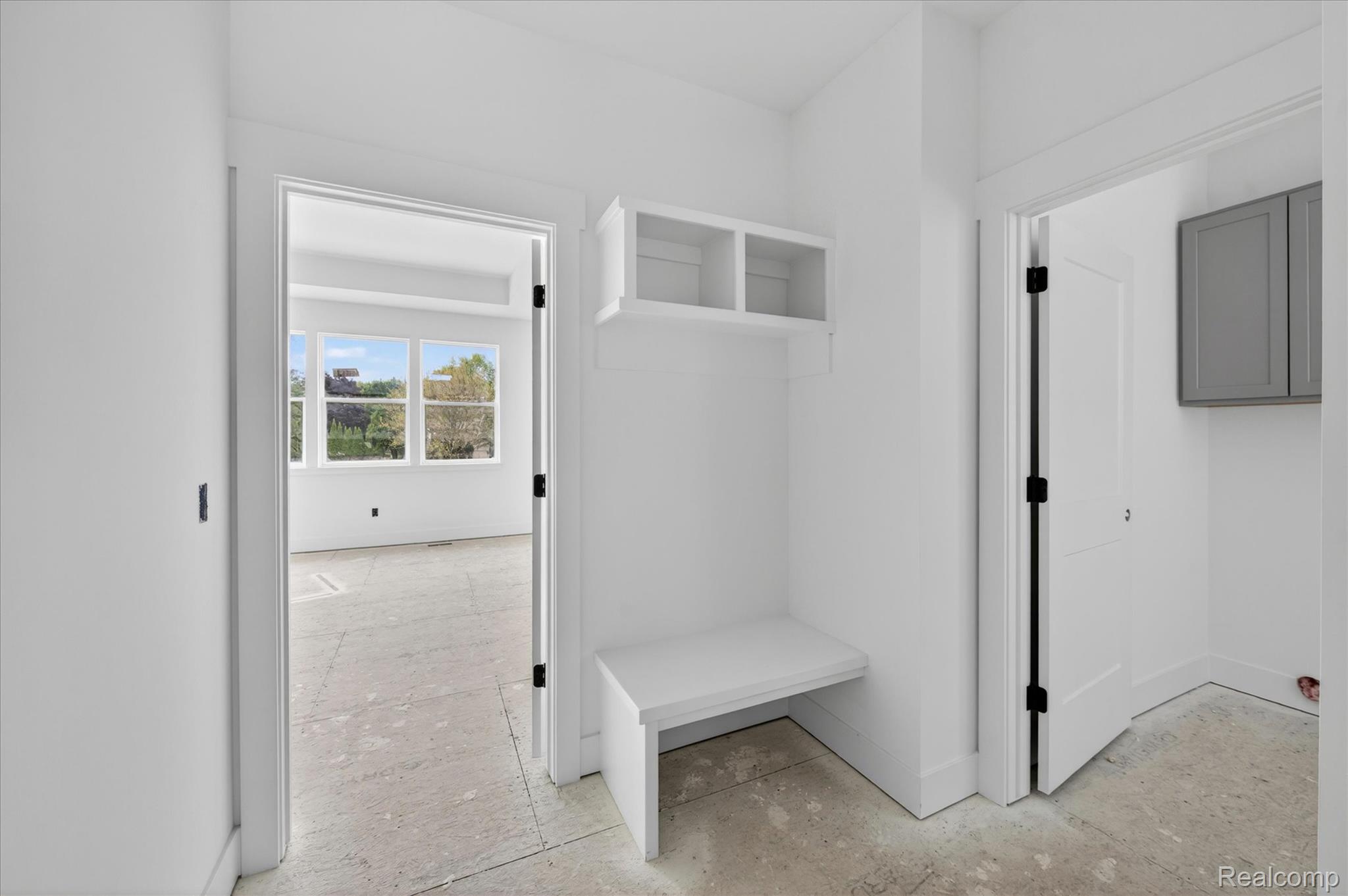 3297 Oak Grove Road Howell, MI 48855 - Photo 18 of 40 Mudroom entry with built-in bench and storage cubbies for everyday organization.