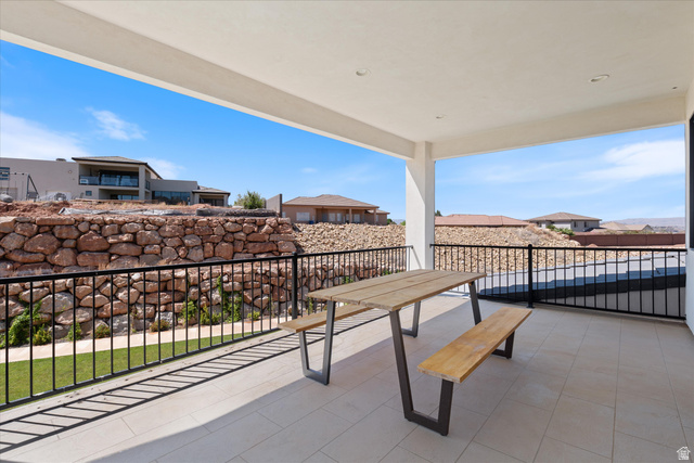 1192 East Corral Way Washington, UT 84780 - Photo 43 of 81 Expansive covered patio featuring a light-toned tiled floor, recessed ceiling lights, and black metal railings