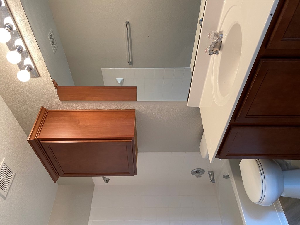 304 Azurite Drive Jarrell, TX 76537 - Photo 19 of 24 Full bathroom featuring shower combination and vanity