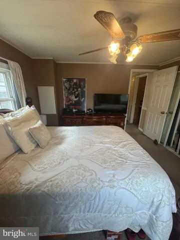 a large white bed in a small room