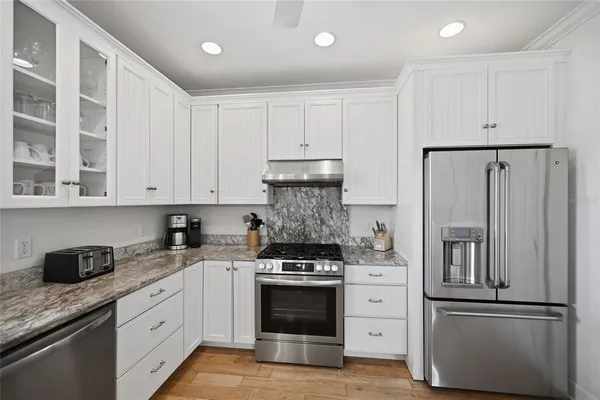 a kitchen with a stove and a sink