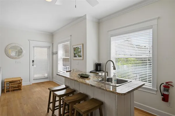 a bedroom with a flat screen tv and a wall painting