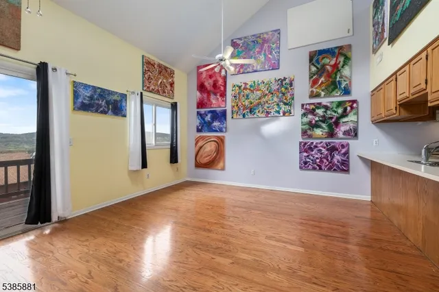 a view of an entryway with wooden floor