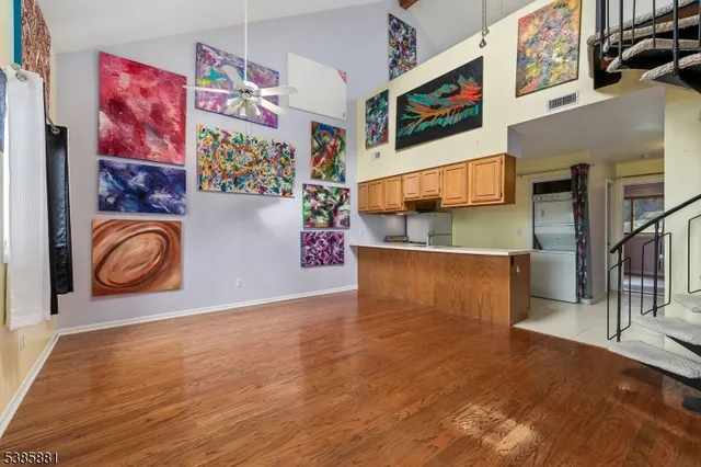 a view of an entryway with wooden floor