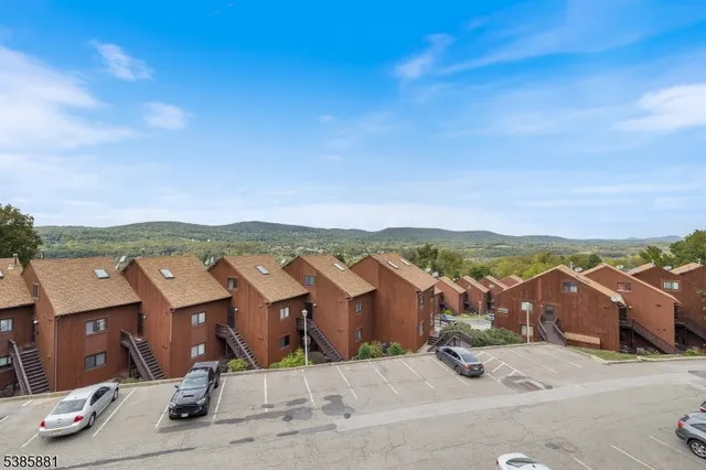 a view of an outdoor space with wooden floor