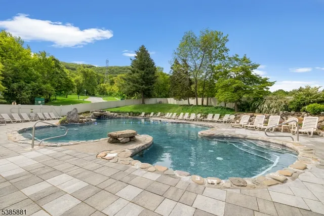 a view of a backyard with sitting area