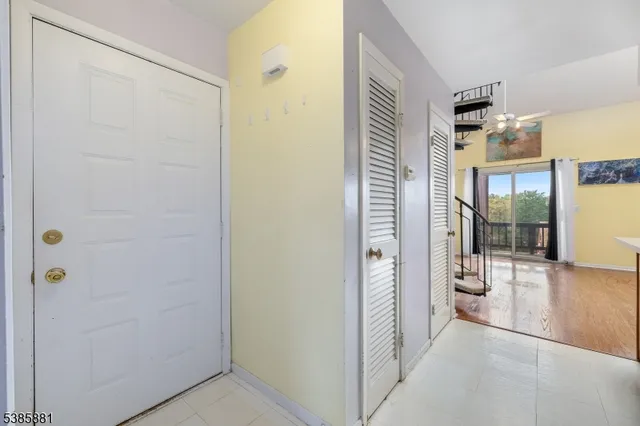 a kitchen with granite countertop a sink cabinets and stainless steel appliances