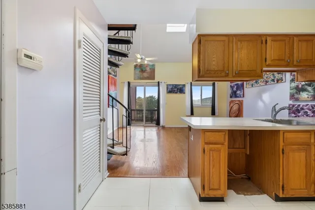 a kitchen with a stove a sink and a refrigerator