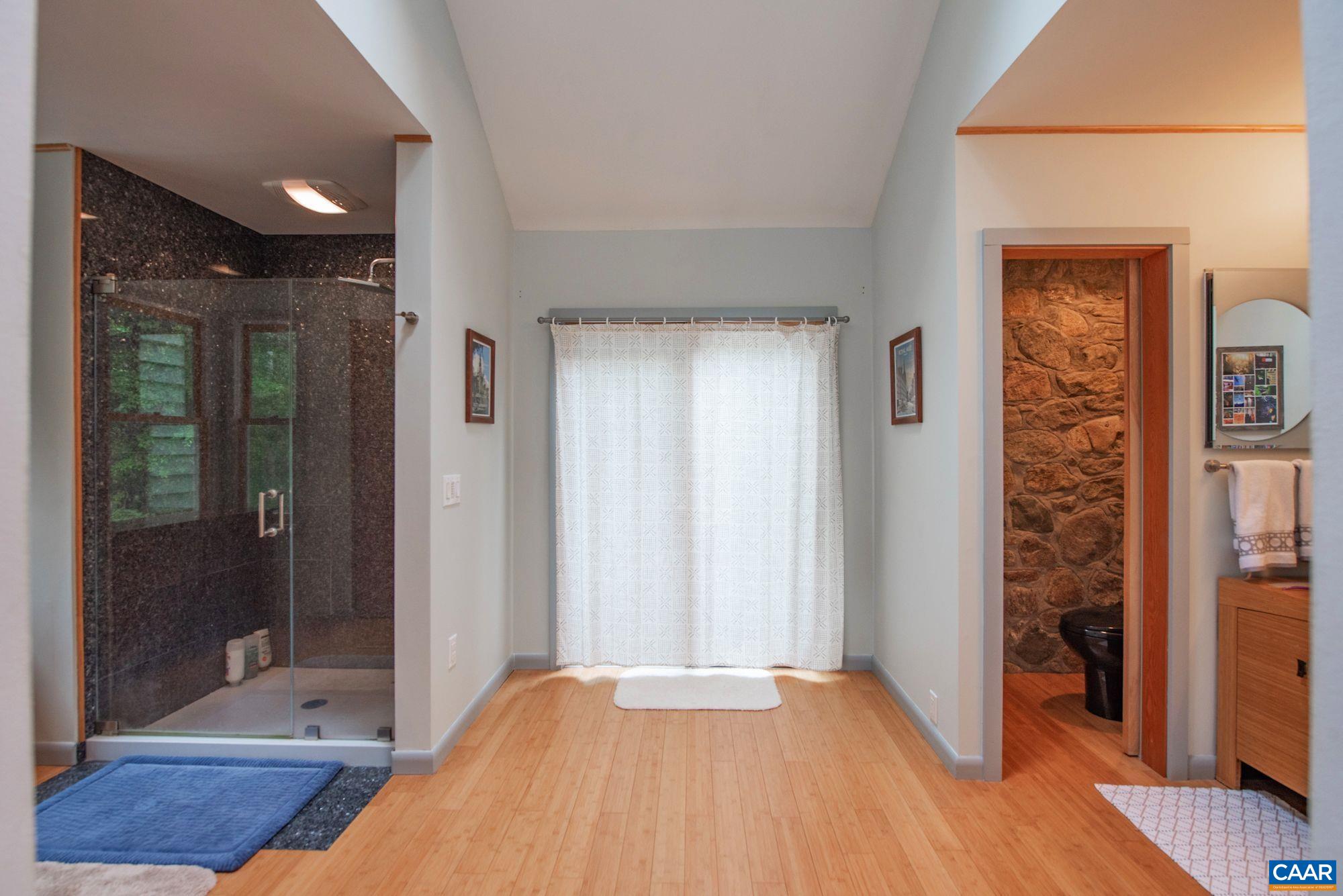 1091 Tilman Road Charlottesville, VA 22901 - Photo 15 of 17 a view of hallway with a front door and wooden floor