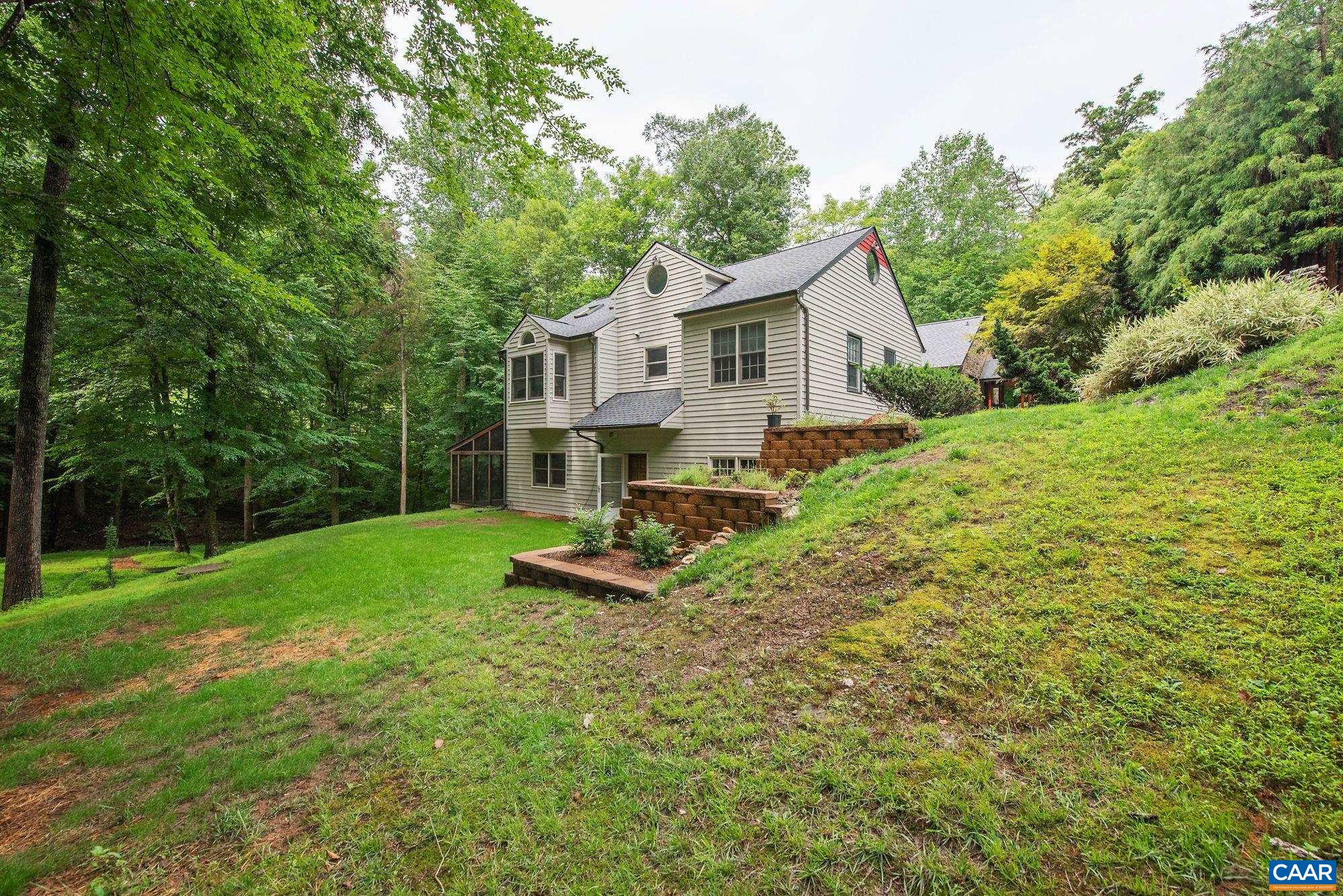 1091 Tilman Road Charlottesville, VA 22901 - Photo 17 of 17 a view of a house with backyard and a tree