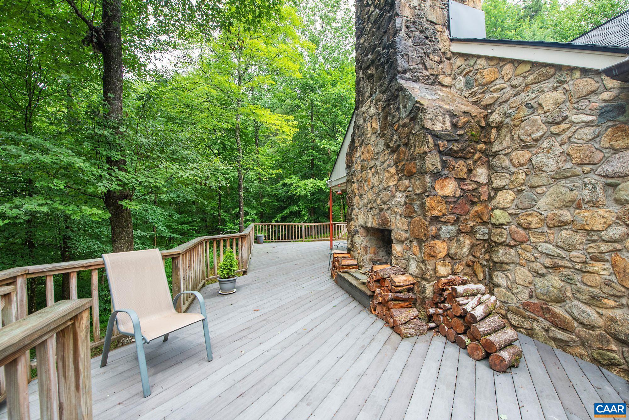 1091 Tilman Road Charlottesville, VA 22901 - Photo 3 of 17 a view of deck with furniture and trees