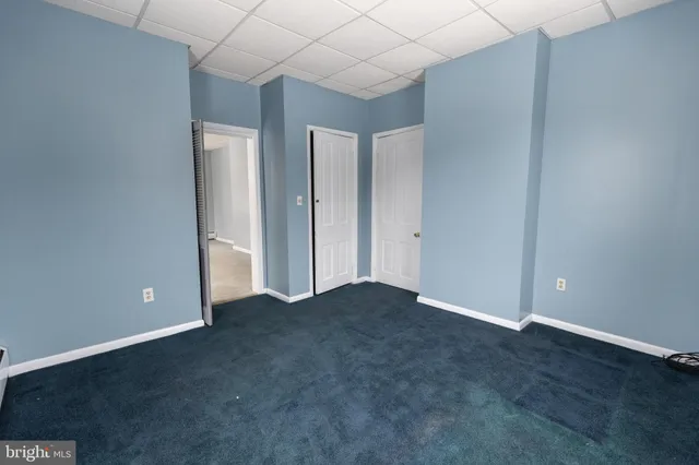 a view of a house with a snow in the background