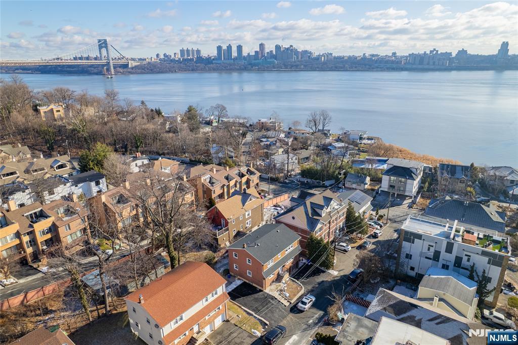 13 Casta Lane, Unit 1 Edgewater, NJ 07020 - Photo 16 of 25 an aerial view of a house with outdoor space and lake view