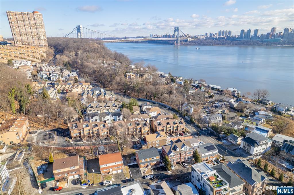 13 Casta Lane, Unit 1 Edgewater, NJ 07020 - Photo 19 of 25 a view of a city and lake