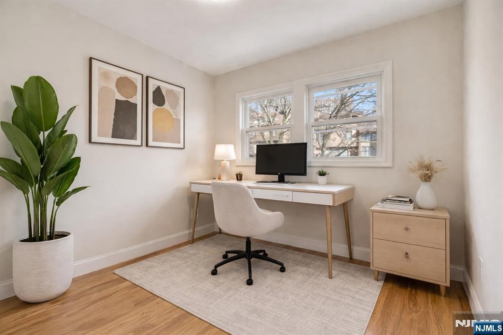 13 Casta Lane, Unit 1 Edgewater, NJ 07020 - Photo 5 of 25 a view of a workspace with furniture and a window