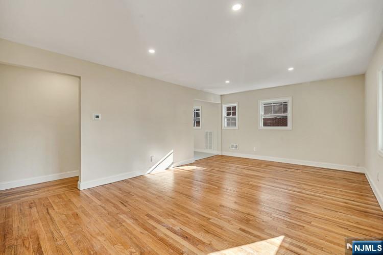 13 Casta Lane, Unit 1 Edgewater, NJ 07020 - Photo 7 of 25 a view of empty room with wooden floor