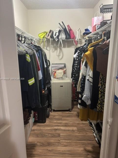 2565 West 56th Street, Unit 107 Hialeah, FL 33016 - Photo 11 of 15 a view of walk in closet with clothes and shoes