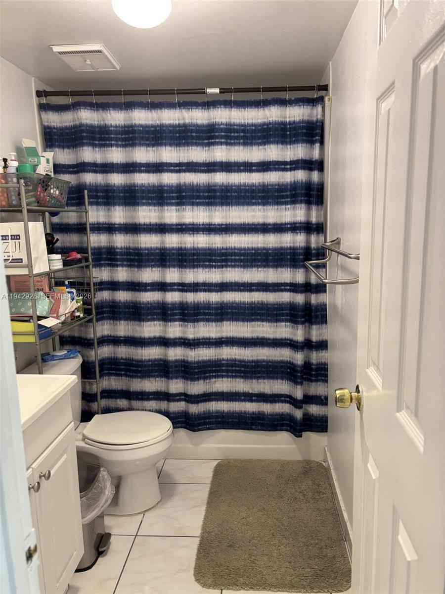 2565 West 56th Street, Unit 107 Hialeah, FL 33016 - Photo 15 of 15 a bathroom with a toilet and a shower