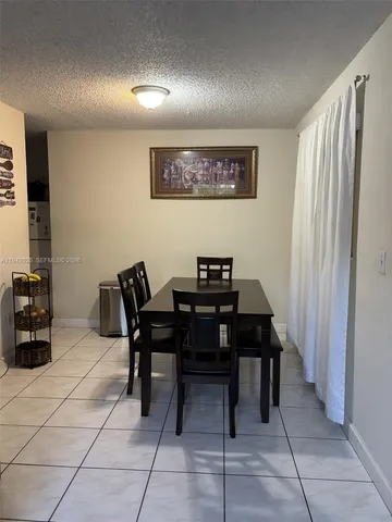 a view of a workspace with furniture