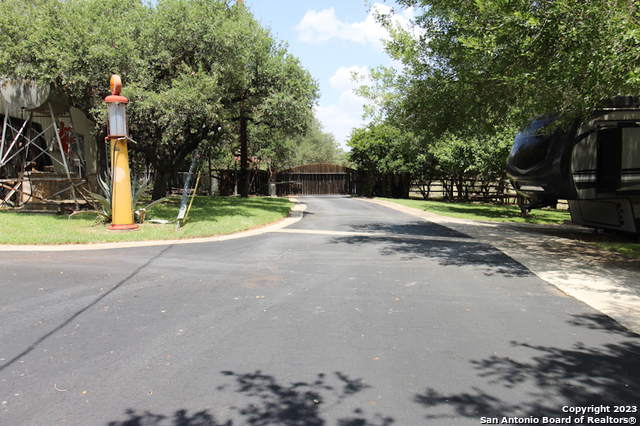 955 Faurie Road, Unit CEDAR CABIN Lakehills, TX 78063 - Photo 19 of 21 a view of a park with swings and slides
