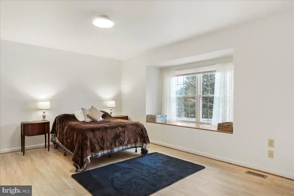 a room that has a bed and a closet in it