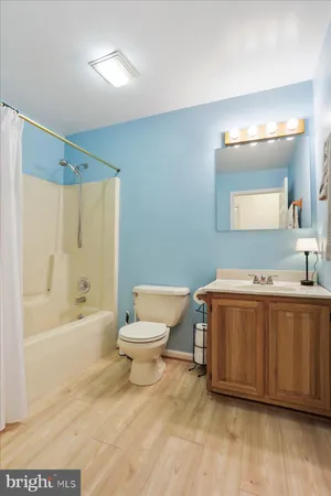 an empty room with wooden floor