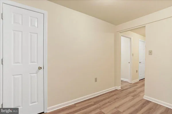 an empty room with wooden floor