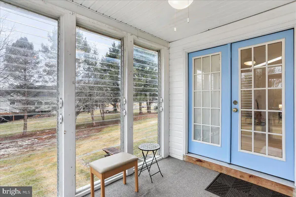 a living room with a large window and a table