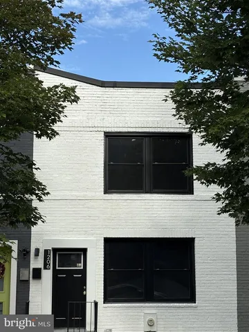 a stove top oven sitting inside of a kitchen
