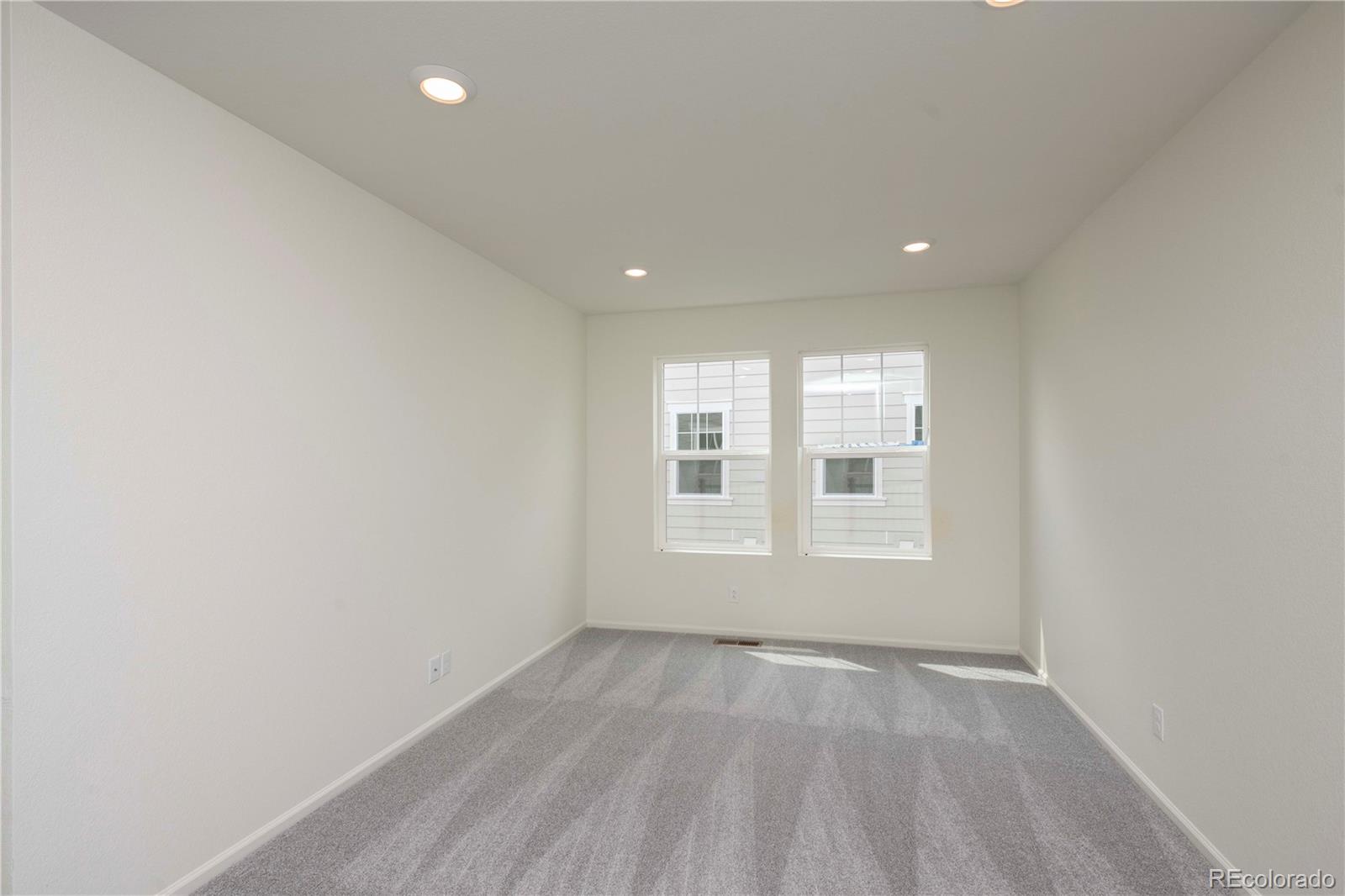 313 Rodden Drive Erie, CO 80516 - Photo 15 of 25 a view of an empty room with a window
