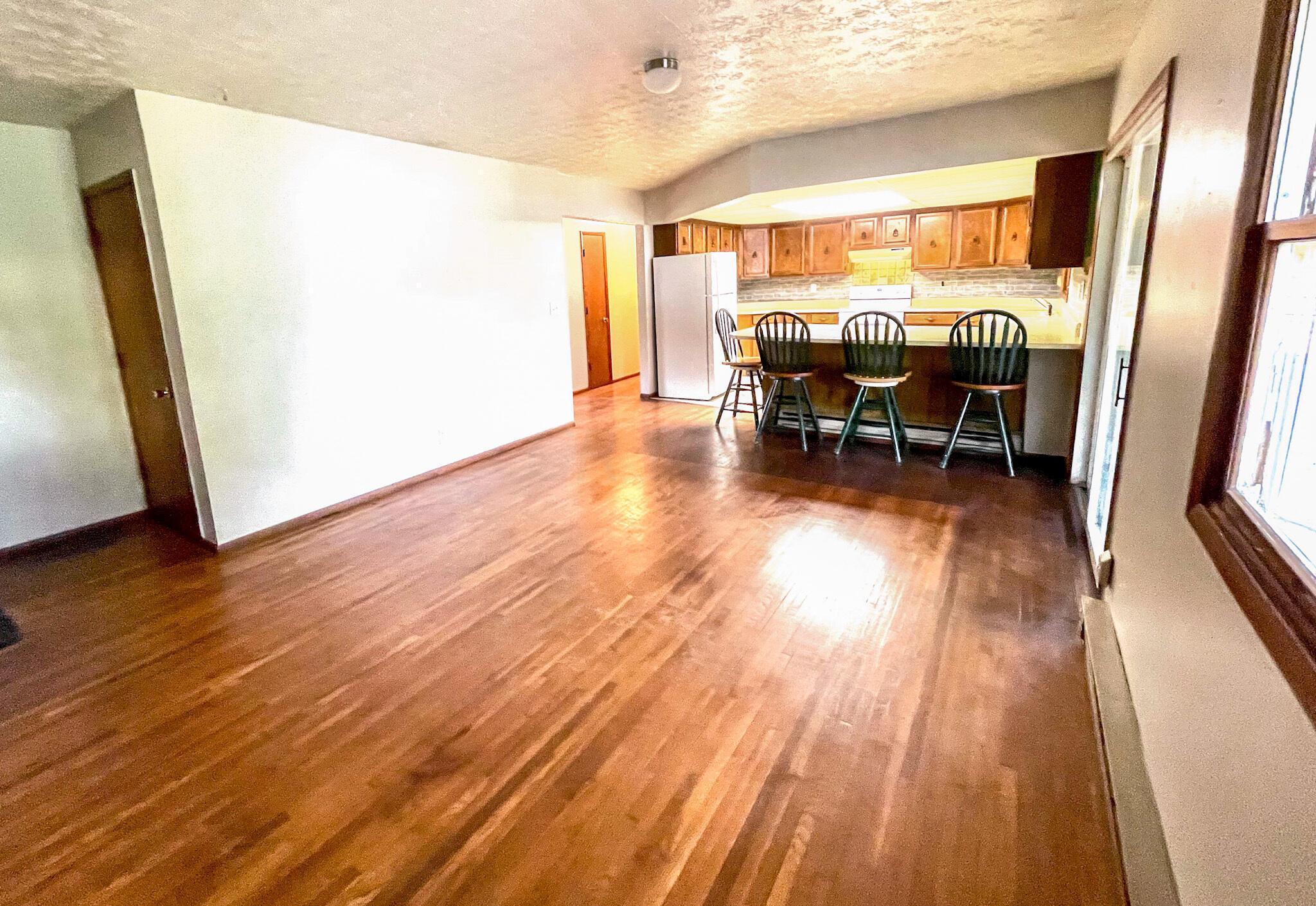 10671 Co Road East Liberty, OH 43319 - Photo 23 of 37 Kitchen and dining room area. Extra large peninsula and new interior wall paint.