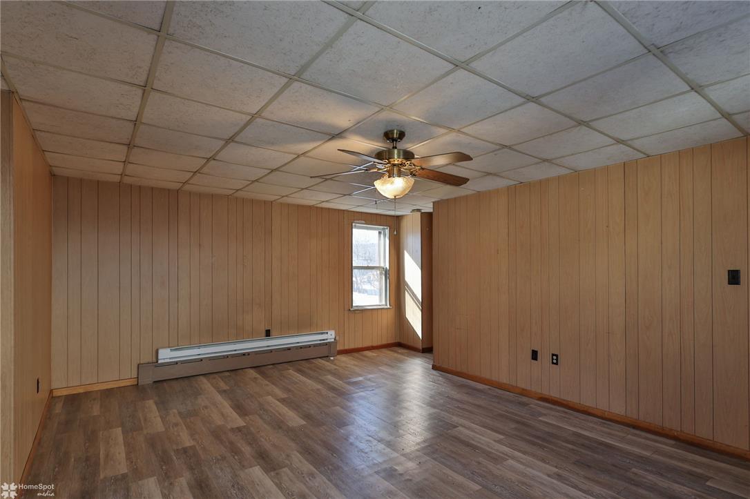 115 East Ruddle Street Coaldale, PA 18218 - Photo 17 of 57 Warm wood paneling wraps this versatile room featuring updated flooring and baseboard heating.