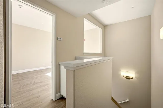 a view of a bathroom with a sink and a mirror
