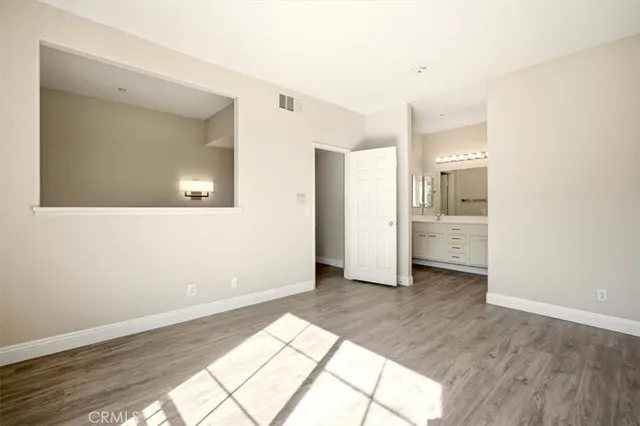 a bathroom with a double vanity sink mirror and shower