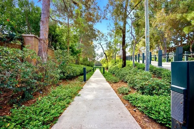 a view of a house with wooden fence