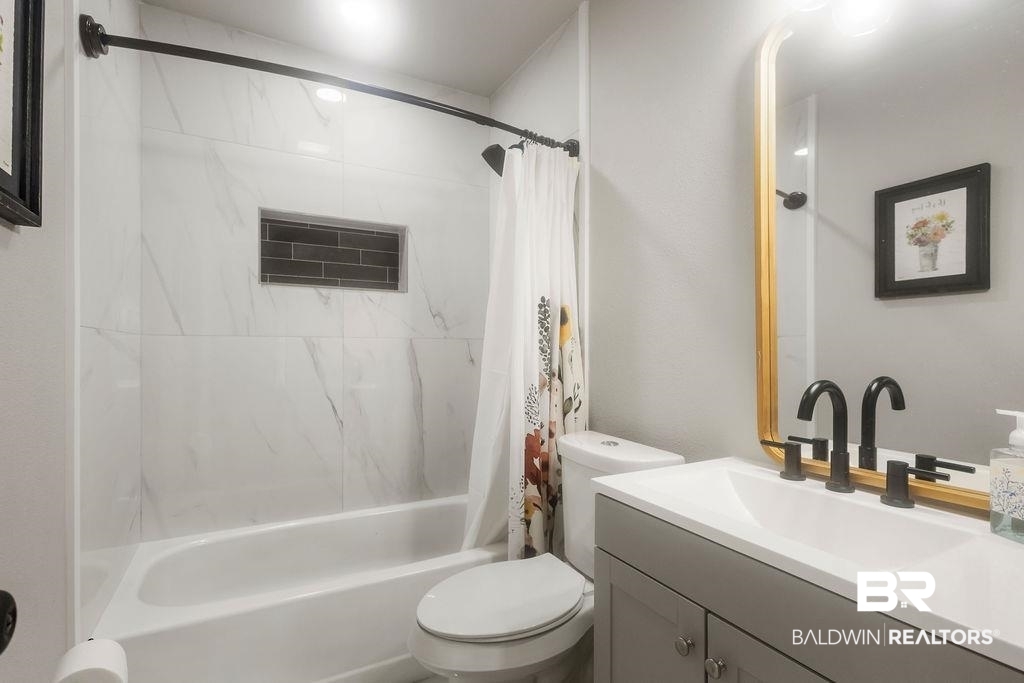 601 East Gate Circle Foley, AL 36535 - Photo 14 of 26 Full bathroom featuring toilet, shower / tub combo, and vanity
