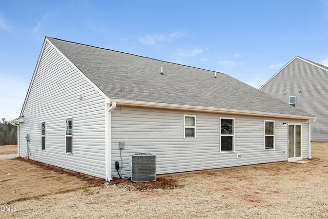 a backyard of a white house