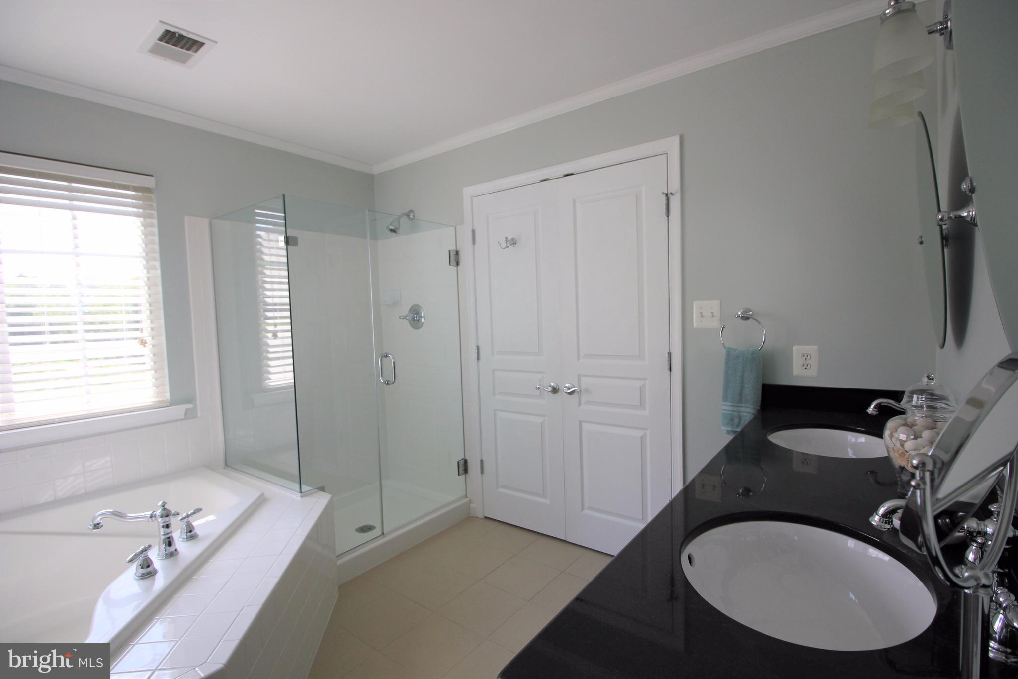6095 Hanover Road Hanover, MD 21076 - Photo 14 of 30 a bathroom with a sink a toilet and shower