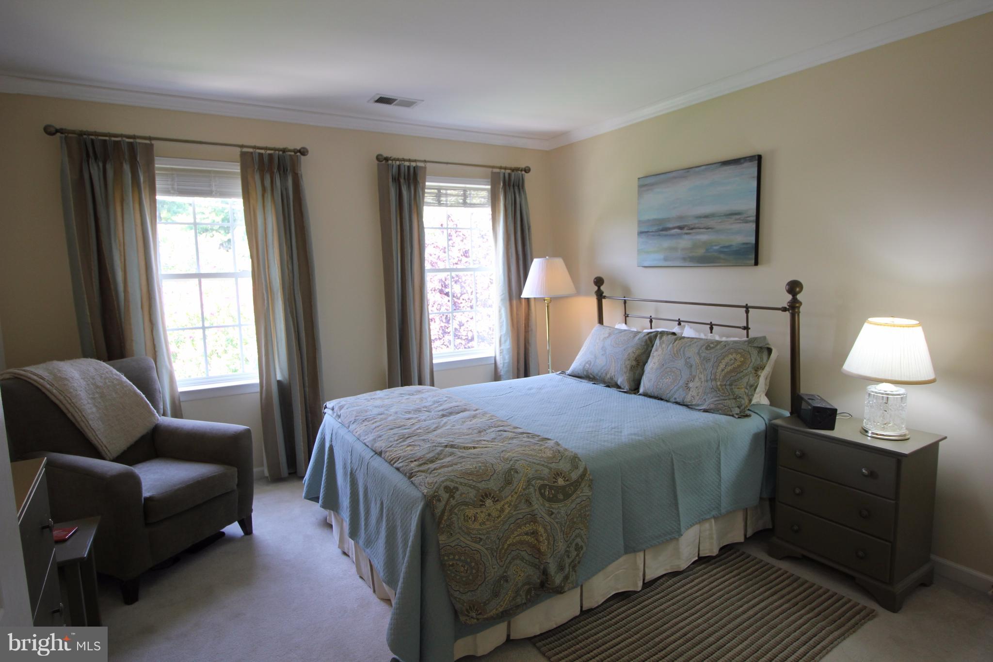 6095 Hanover Road Hanover, MD 21076 - Photo 18 of 30 a bedroom with a bed and wooden floor