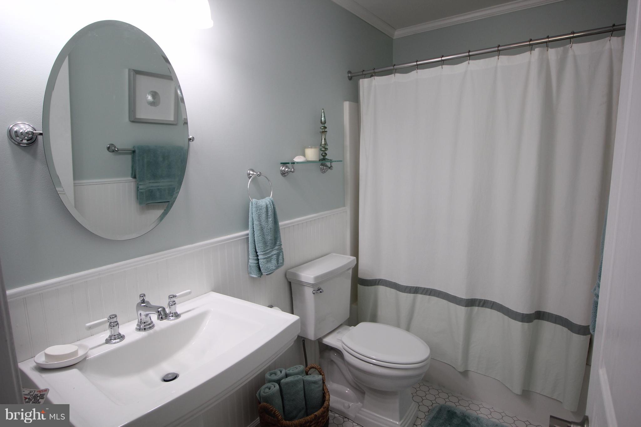 6095 Hanover Road Hanover, MD 21076 - Photo 21 of 30 a bathroom with a sink toilet and a mirror